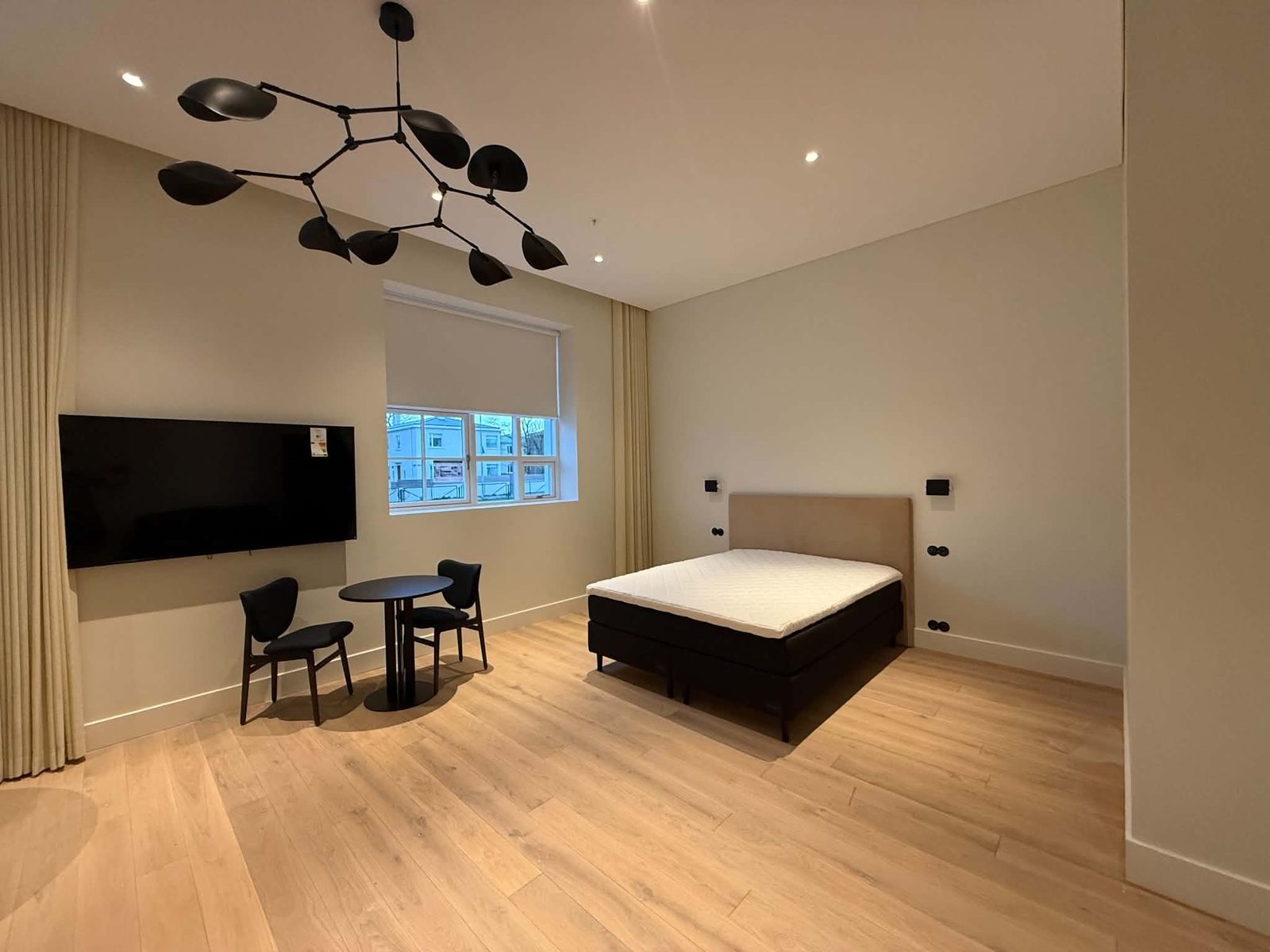 Bedroom — after, designer lighting + oak floor + finished walls