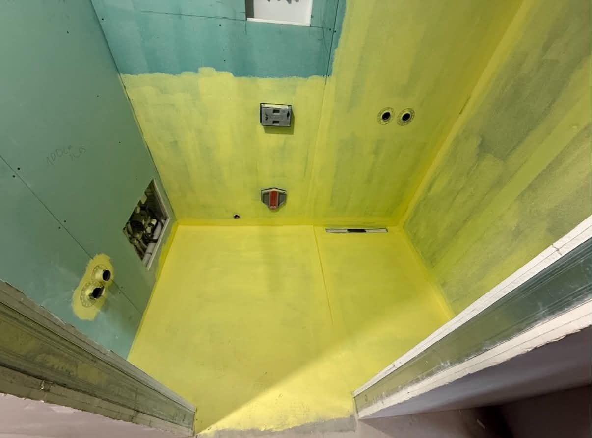 Wet-room — before, yellow waterproofing membrane